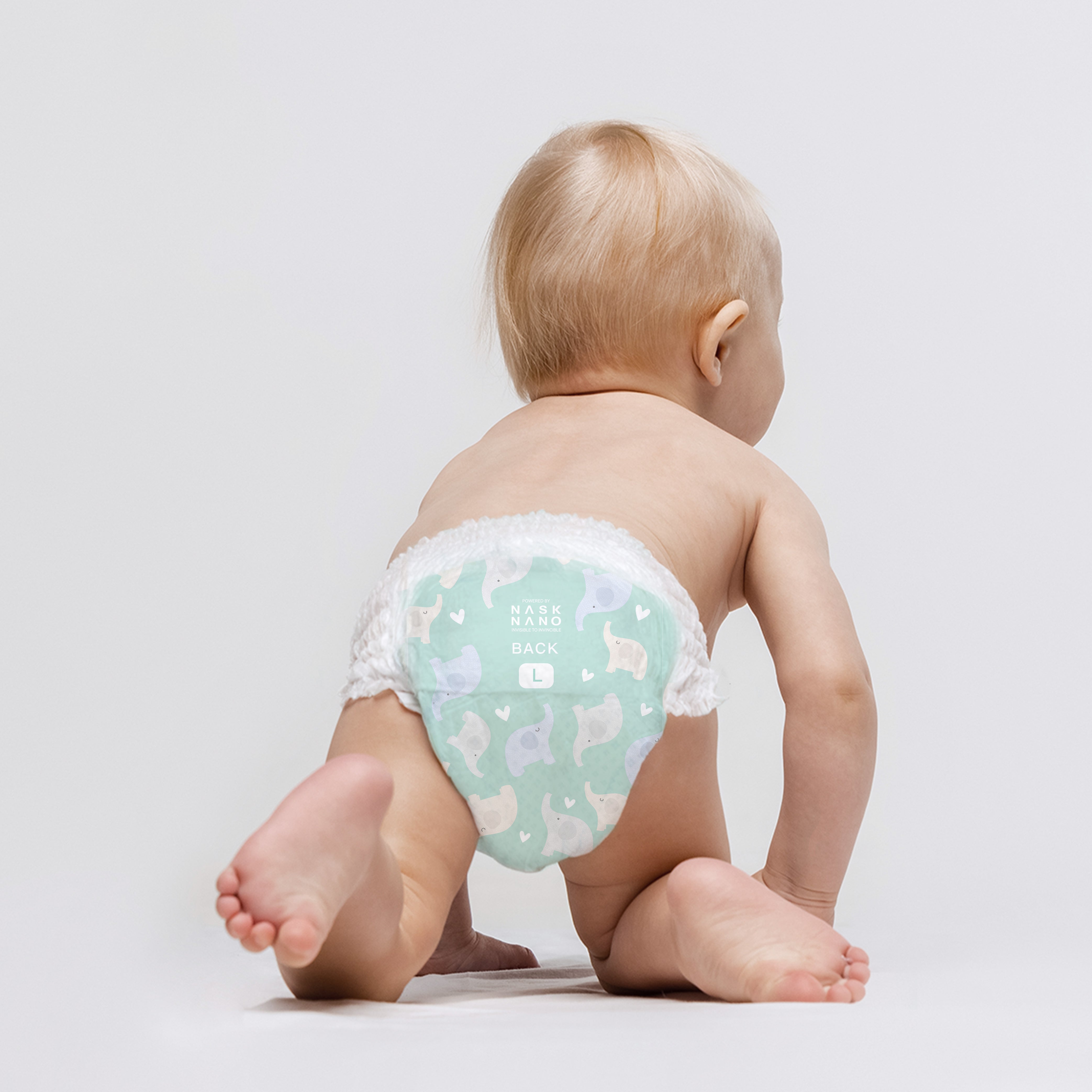 A baby is wearing NASK nanofiber baby pants in L size