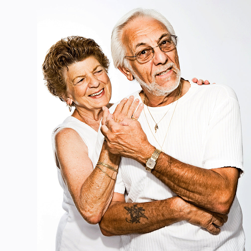 An old couple is hugging each other