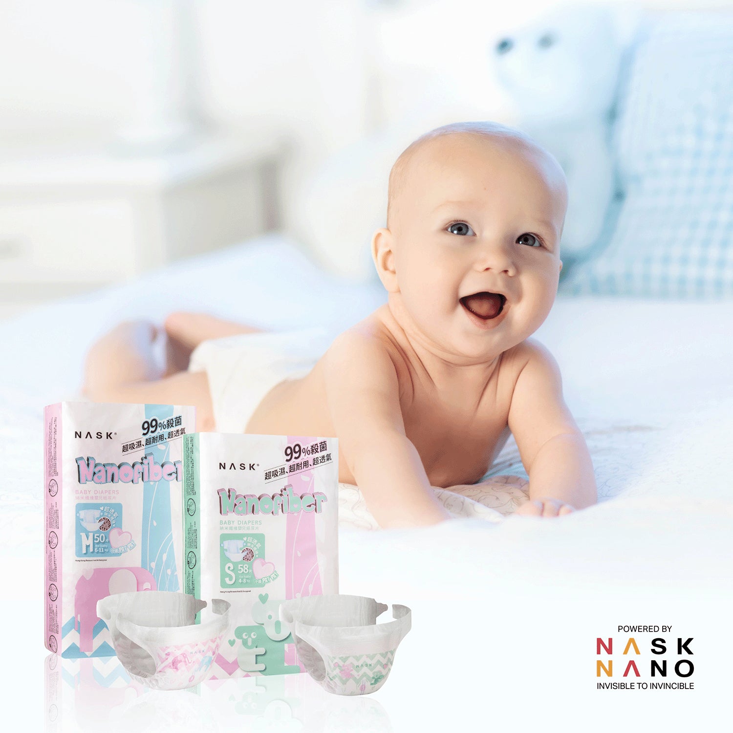 two sizes of nask baby diaper besides a baby